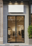 Modern boutique entrance with glass doors and neutral tones
