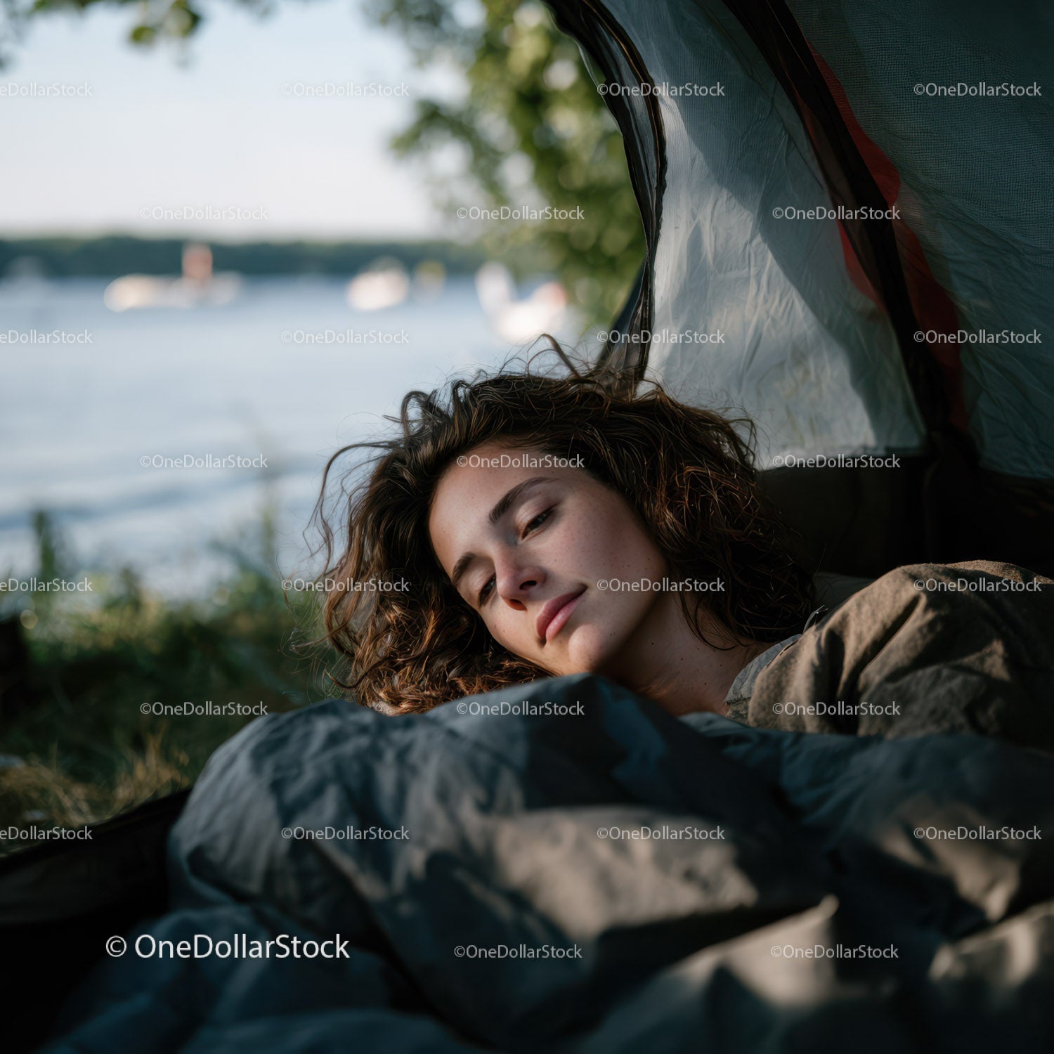 Young Woman Relaxing on Camping Sleeping Bag by the River