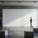 Modern office lobby with large blank white wall and businessmen