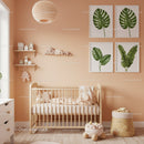 Modern Nursery Room with Green Monstera Leaf Wall Art and Baby Crib