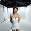 Young Woman Smiling in White Dress in Studio Portrait