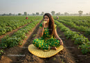 Woman in traditional saree enjoying snack in green field