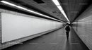 Minimalist Subway Tunnel with Tiled Walls and Modern Lighting