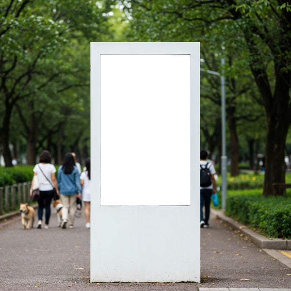 Blank white billboard in busy green city park walkway JPG Mockup Image