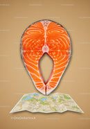 Fresh salmon steak placed on folded city map