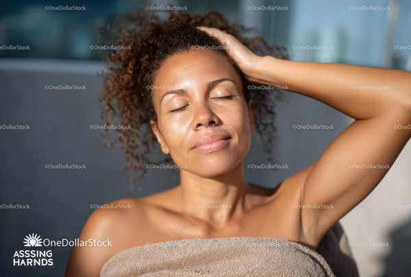 Relaxing Woman with Curly Hair Enjoying Sunlight Outdoors