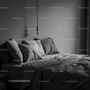 Modern bedroom with gray pillows and minimalist decor