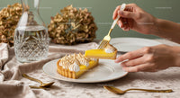 Elegant Lemon Tart with Meringue on Stylish Table in Soft Lighting