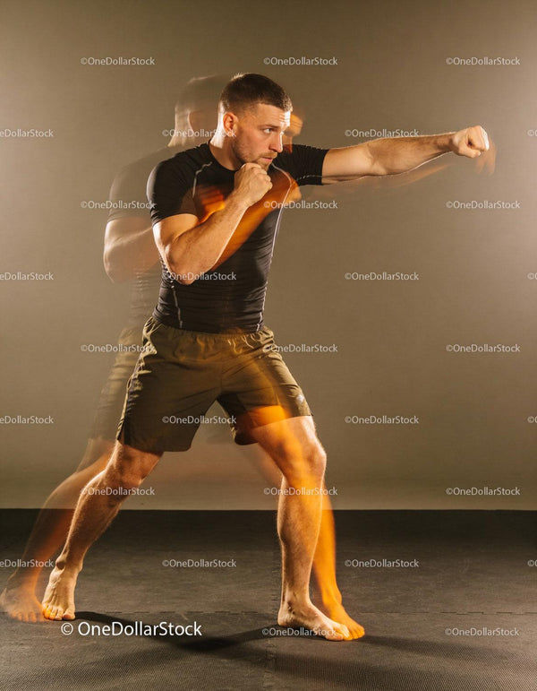 Athlete practicing boxing punches with focus and energy
