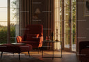 Cozy red armchair by sunlit window with elegant decor