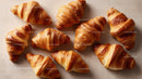 Golden Croissants with Flaky Layers in a Bakery Display