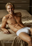 Smiling man relaxing on bed in white underwear