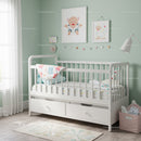 Bright Nursery with White Baby Crib and Playful Wall Art