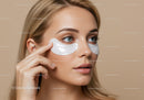 Woman with Blue Eyes Applying Under-Eye Patches for Skincare