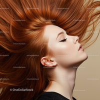Profile of calm woman with flowing red hair