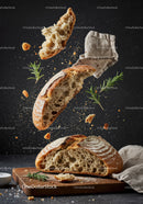 Rustic sourdough bread with fresh rosemary on wooden board