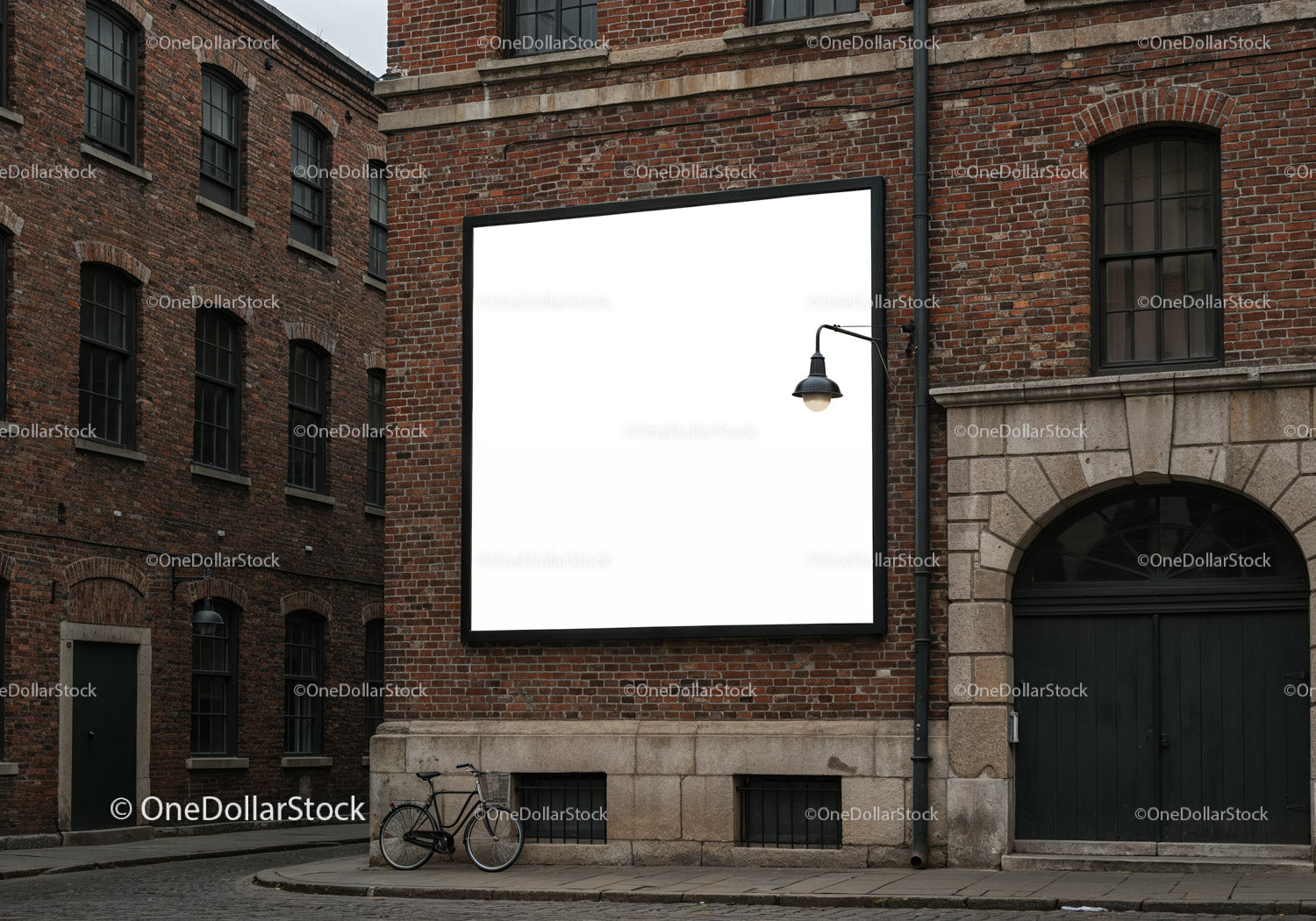 Empty square billboard on red brick building facade