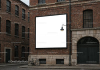 Empty square billboard on red brick building facade