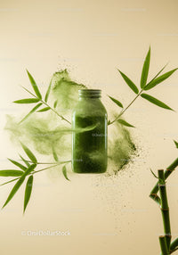 Green Matcha Powder Bottle Surrounded by Bamboo Leaves