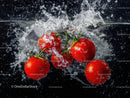 Fresh Ripe Cherry Tomatoes Splashing Water on Black Background