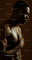 Artistic Portrait of a Young Man with Metallic Feather Body Art in Warm Studio Lighting