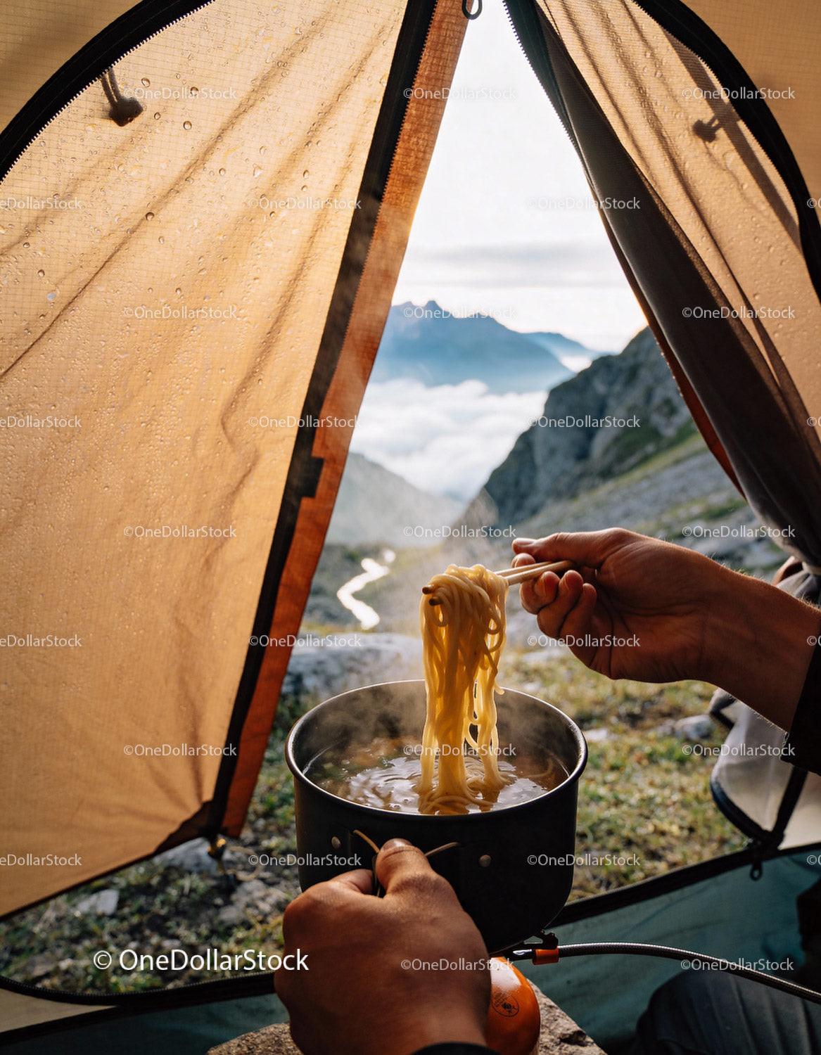 Preparing Hot Noodles on Camping Stove with Mountain View