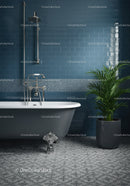 Elegant clawfoot bathtub with green plant in blue bathroom