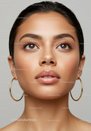 Close-up of Beautiful Woman with Glamorous Makeup and Hoop Earrings