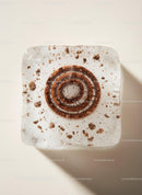 Frozen Coffee Ice Cube with Visible Brown Swirls