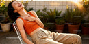 Joyful woman relaxing outdoors in warm sunlight