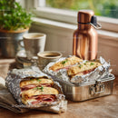 Panini Sandwiches with Ham and Fresh Herbs on Rustic Wooden Table
