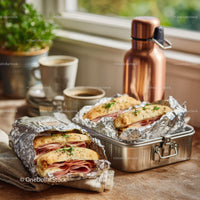 Panini Sandwiches with Ham and Fresh Herbs on Rustic Wooden Table