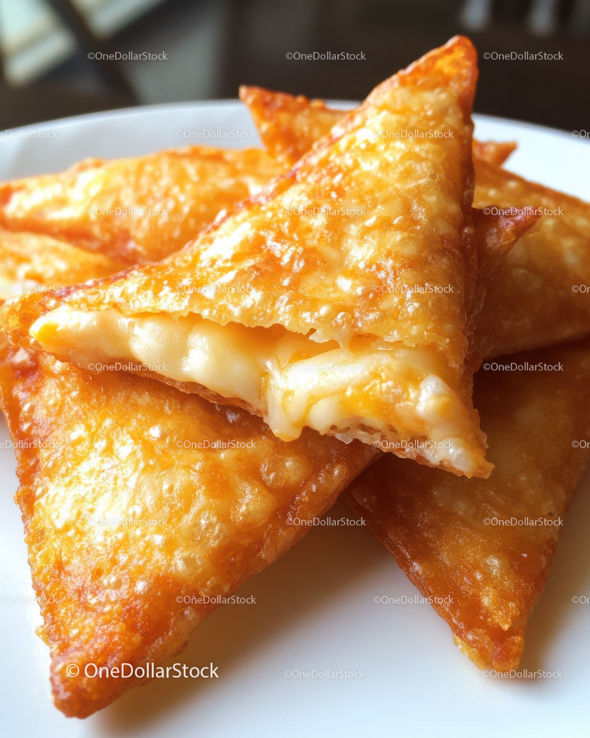 Close-up of Crispy Fried Cheese Triangles with Melty Filling