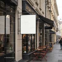 Cozy street cafe with empty signboard on historic city sidewalk