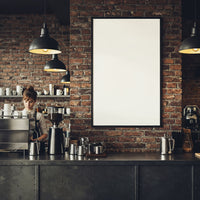 Barista Preparing Coffee Behind Industrial Cafe Counter
