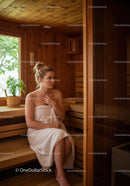 Young Woman Relaxing in Sauna with Wooden Interior and Natural Light
