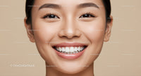 Close up of smiling young Asian woman with flawless skin