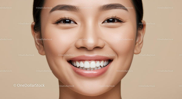 Close up of smiling young Asian woman with flawless skin