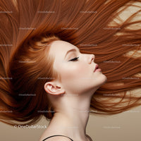 Profile of woman with flowing vibrant red hair