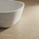 Elegant White Bathtub with Curved Design on Terrazzo Floor for Modern Bathroom