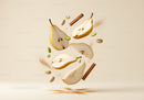 Floating slices of ripe pear with cinnamon and pistachios