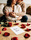 Couple Embracing on Sofa with Romantic Love Note
