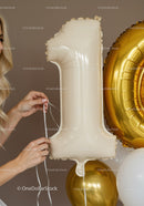 Hands Adjusting White Number One Balloon for Celebration