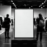 Blank vertical frame in modern clothing store interior