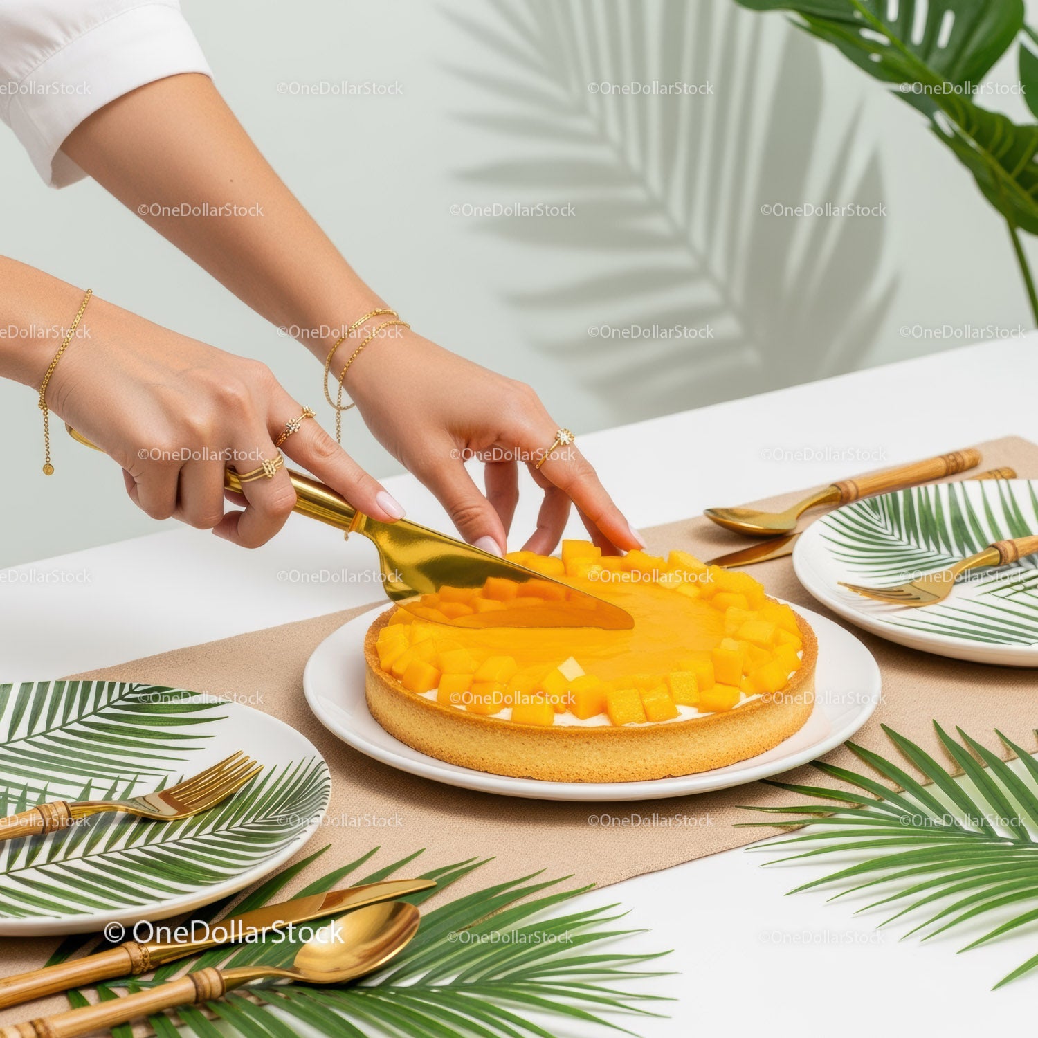 Elegant Mango Tart Slice in Tropical Decor with Gold Jewelry