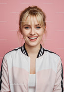 Smile of a Cheerful Young Woman in Casual Outfit on Pink Background