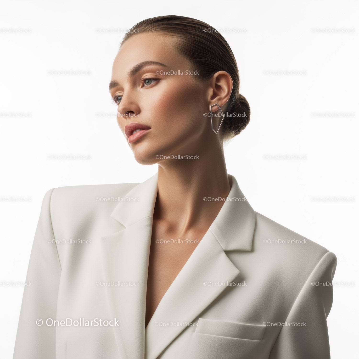 Elegant Woman in White Blazer with Sleek Bun and Trendy Earrings