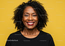 Portrait of a Smiling Woman with Curly Hair and Hoop Earrings Against Yellow Background