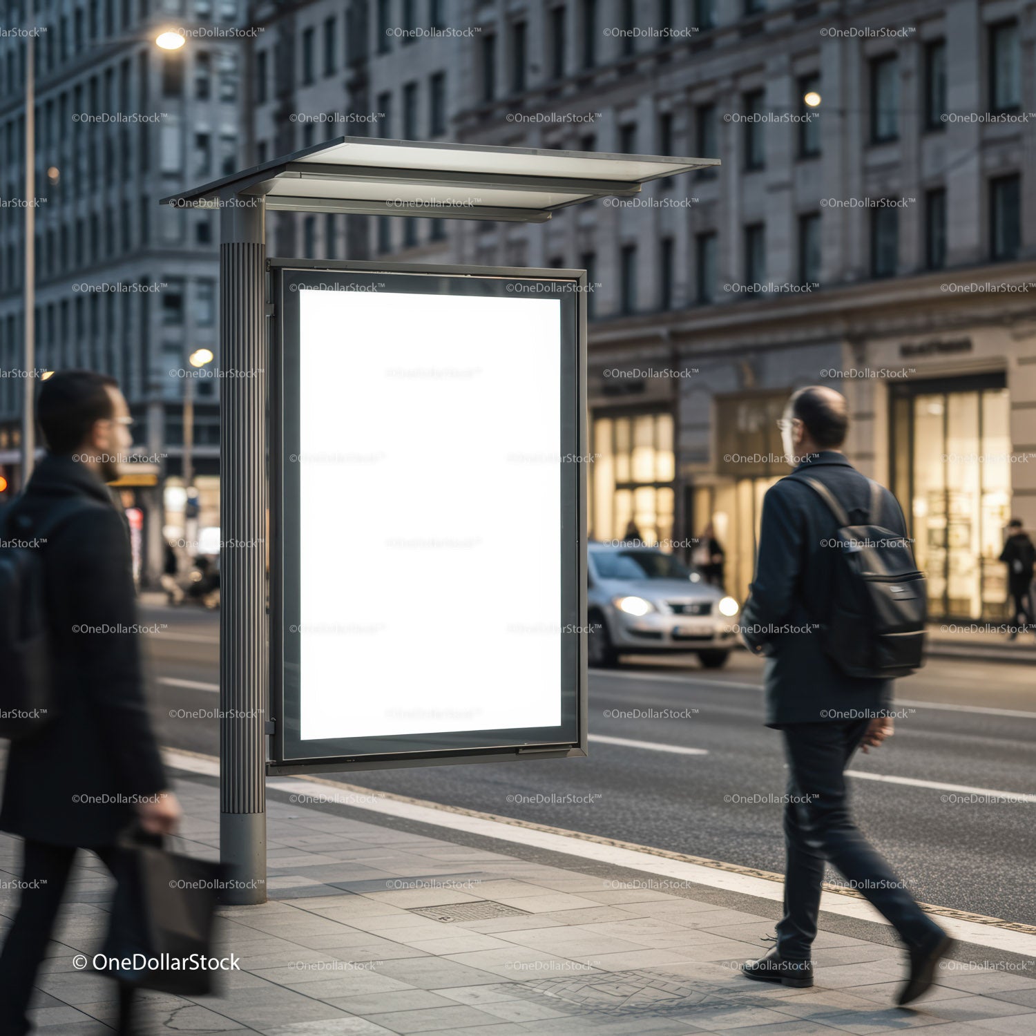 Blank illuminated city bus stop advertisement at dusk