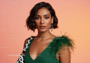 Elegant Woman in Green Dress with Feather Detail and Statement Earrings